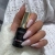 Yoshi Top Holo 10 ml — butelka w dłoni